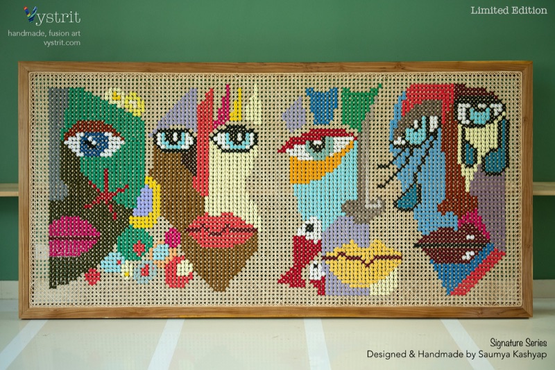 The Masks We Wear: four faces in one row across an eight foot cane panel, the two in the middle worked as brightly coloured masks.